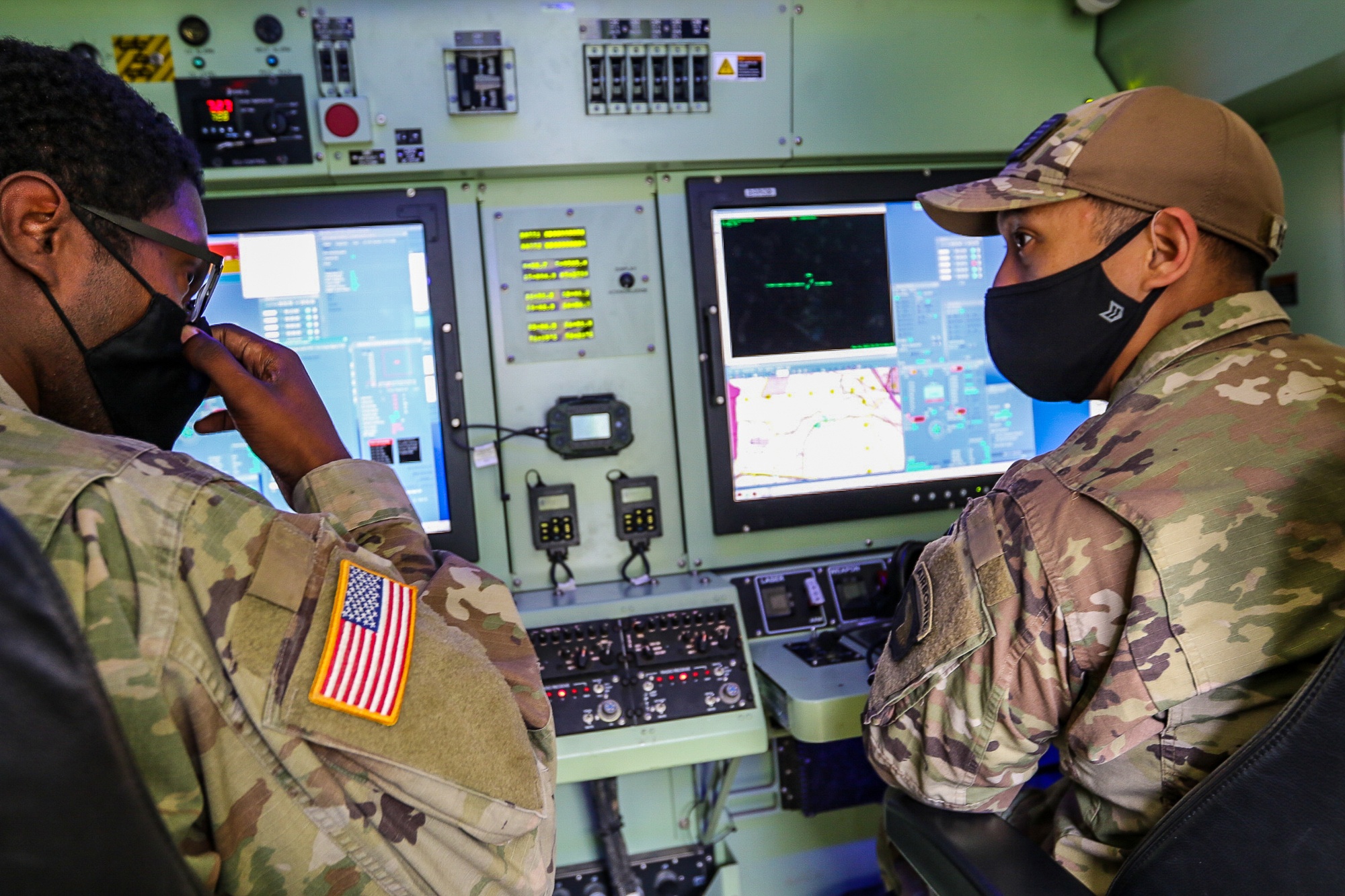 A military drone operator at a ground station controlling a fiber-optic guided drone