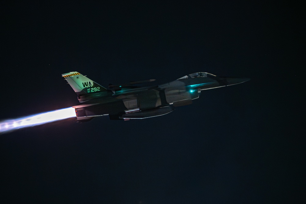 F-16 assigned to the 64th Aggressor Squadron taking off for a night mission during Red Flag exercise at Nellis Air Force Base