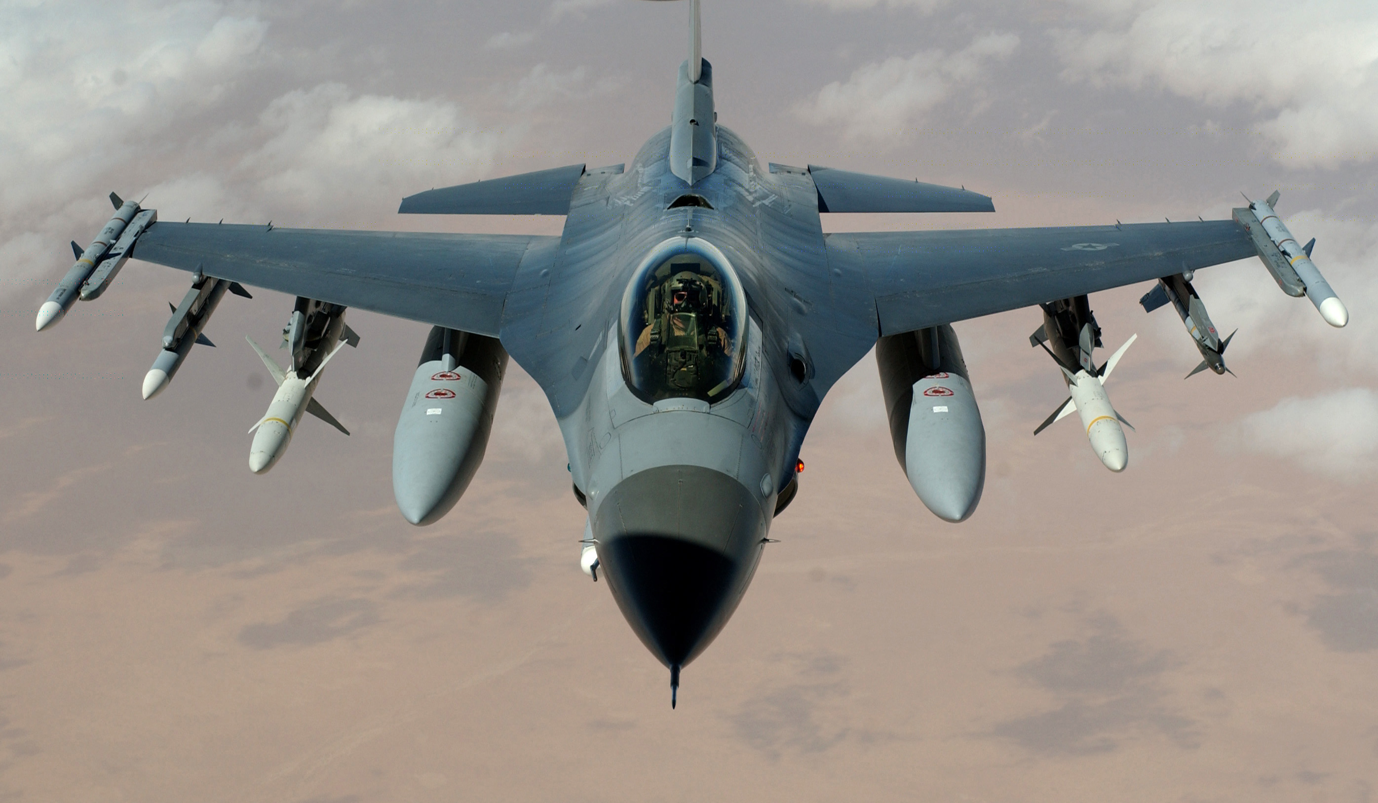 F-16 Fighting Falcon performing a high-G maneuver demonstrating the agility enabled by its fly-by-wire system and relaxed static stability