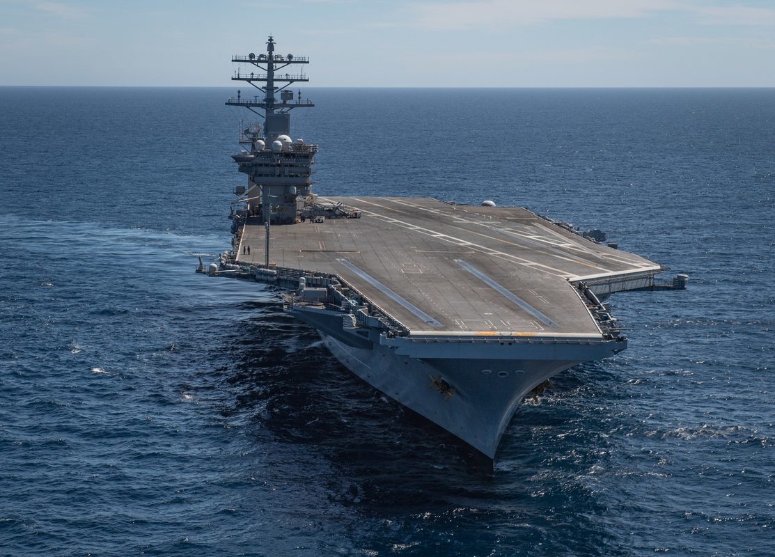 USS Nimitz (CVN 68) underway in the Pacific Ocean, aerial view showing the flight deck and island superstructure