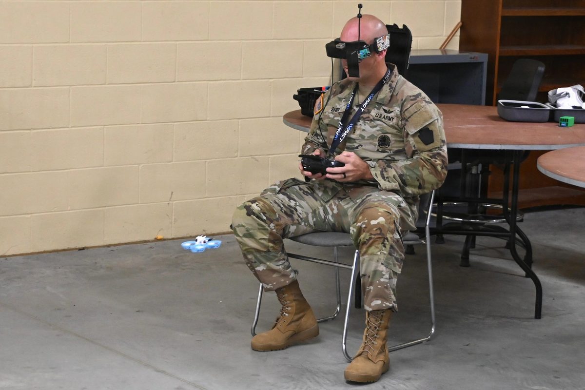 Soldiers preparing small drone systems for deployment during training operations