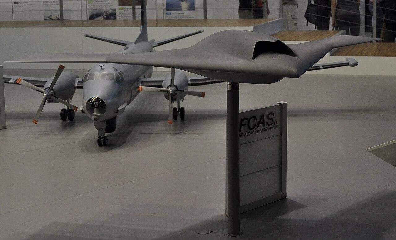 Concept art showing AI-controlled Collaborative Combat Aircraft flying in formation with an F-35 fighter