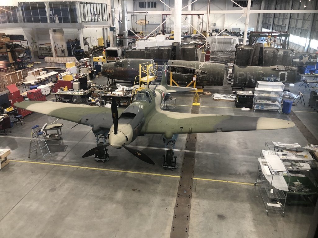 Restored IL-2 Sturmovik in a workshop showing the armored fuselage shell