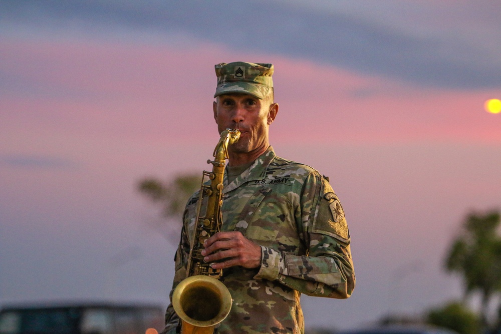 An Army Band musician in formal uniform holding an instrument