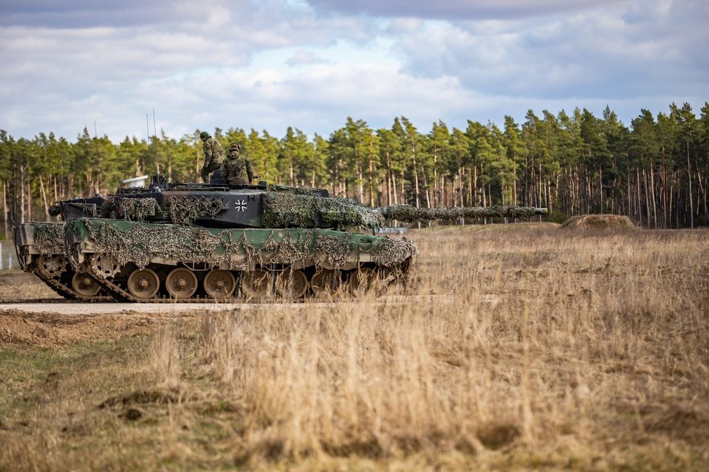 German Leopard 2A6 main battle tank maneuvering onto a firing range during a combined arms live fire exercise in Poland