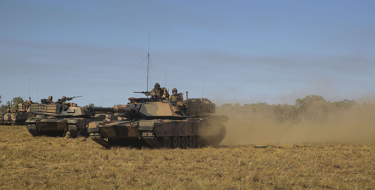 A destroyed tank in eastern Ukraine illustrating the vulnerability of heavy armor to modern anti-tank weapons and FPV drones