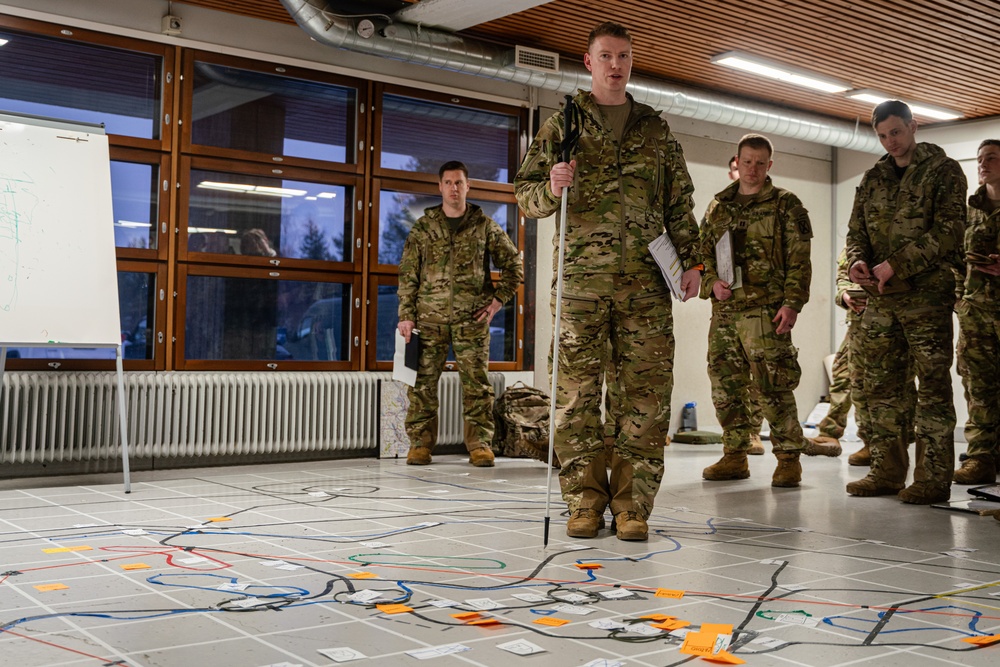 Military personnel testing experimental robotic and autonomous systems
