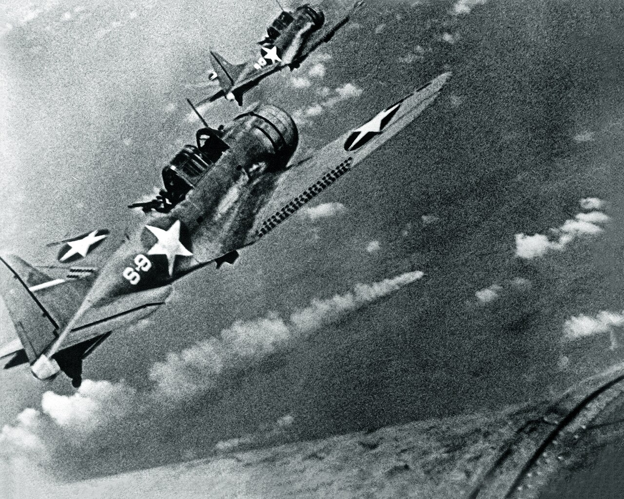 SBD Dauntless dive bombers in flight during World War II, the type that struck the decisive blows at Midway