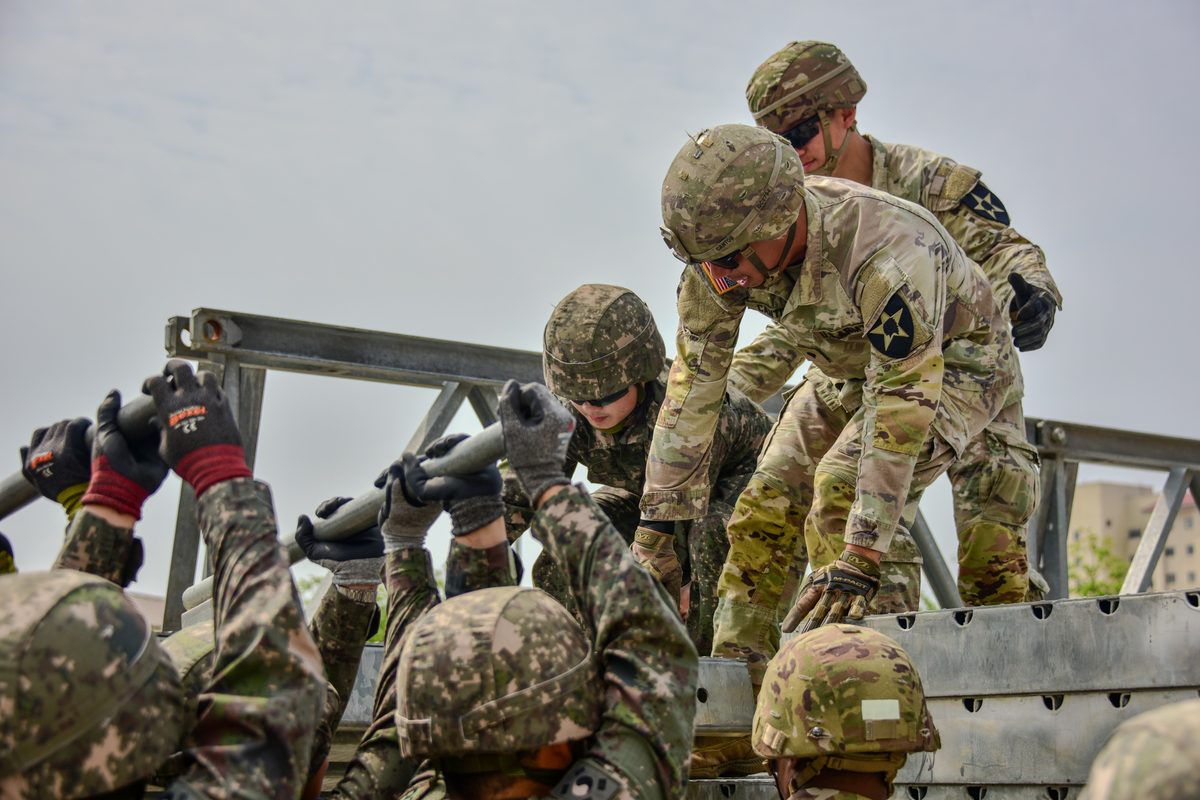 U.S. and South Korean Army engineers conducting joint bridge-building training over the Imjin River