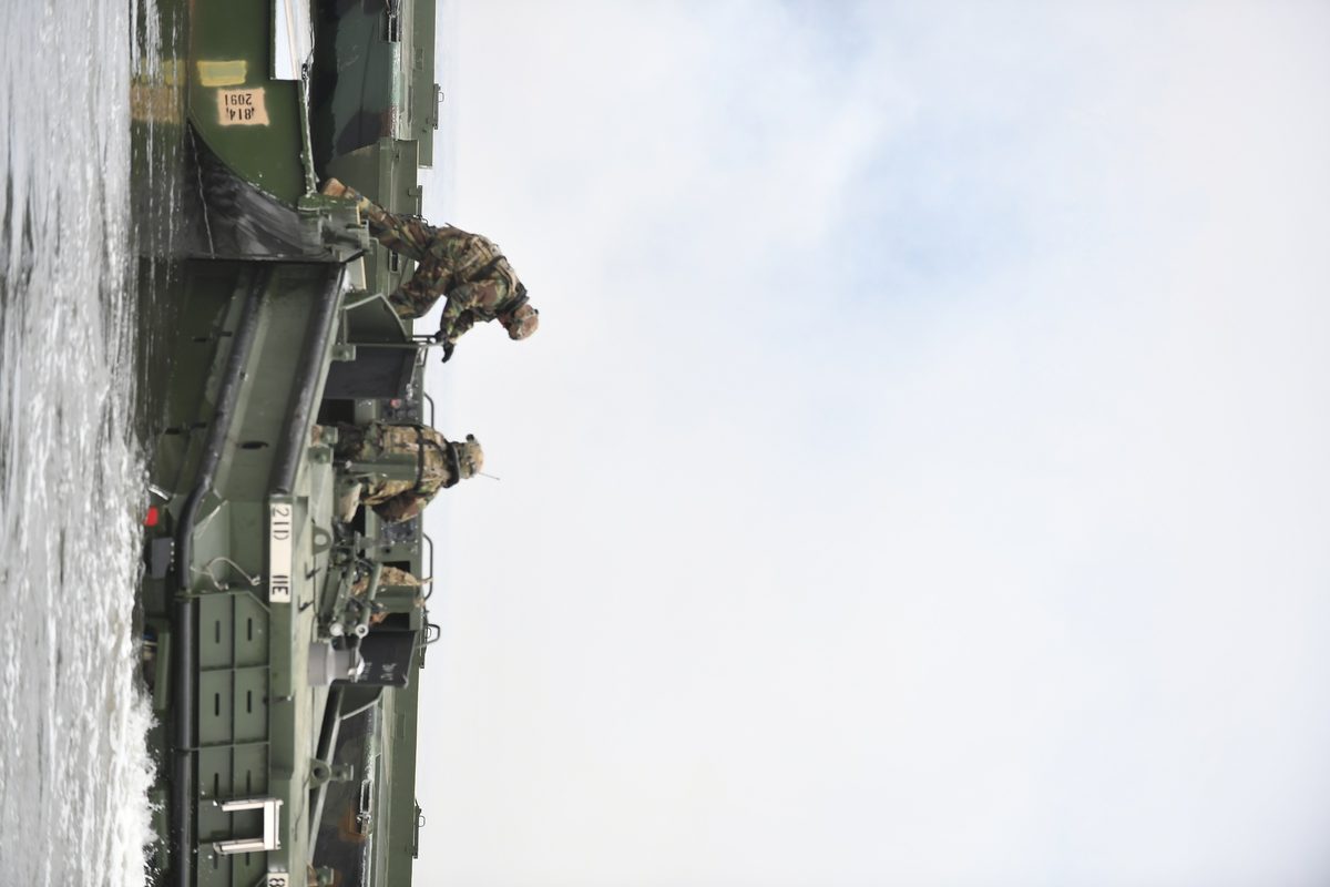 Completed pontoon bridge spanning a river in South Korea during a military exercise