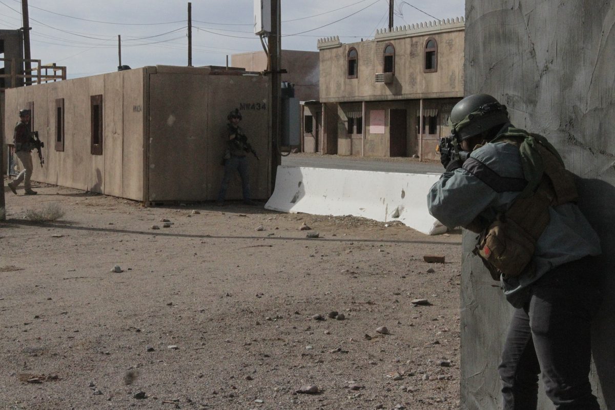 11th Armored Cavalry Regiment troopers maintain defensive positions in the training city of Ujen at the National Training Center