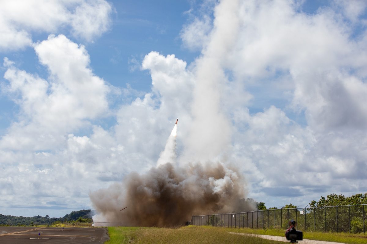 Patriot air defense missile launching with a trail of smoke against a clear sky