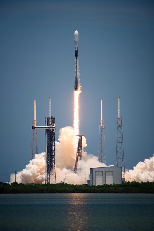 GPS III satellite launching from Cape Canaveral Space Force Station aboard a rocket at night