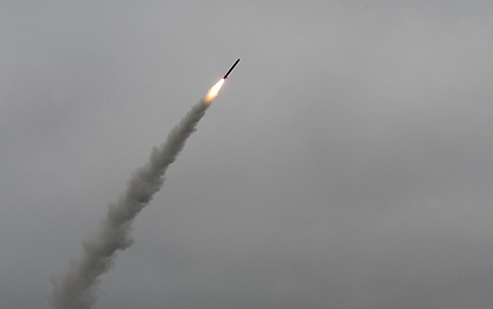 Tomahawk cruise missile ascending through clouds after launching from a submarine