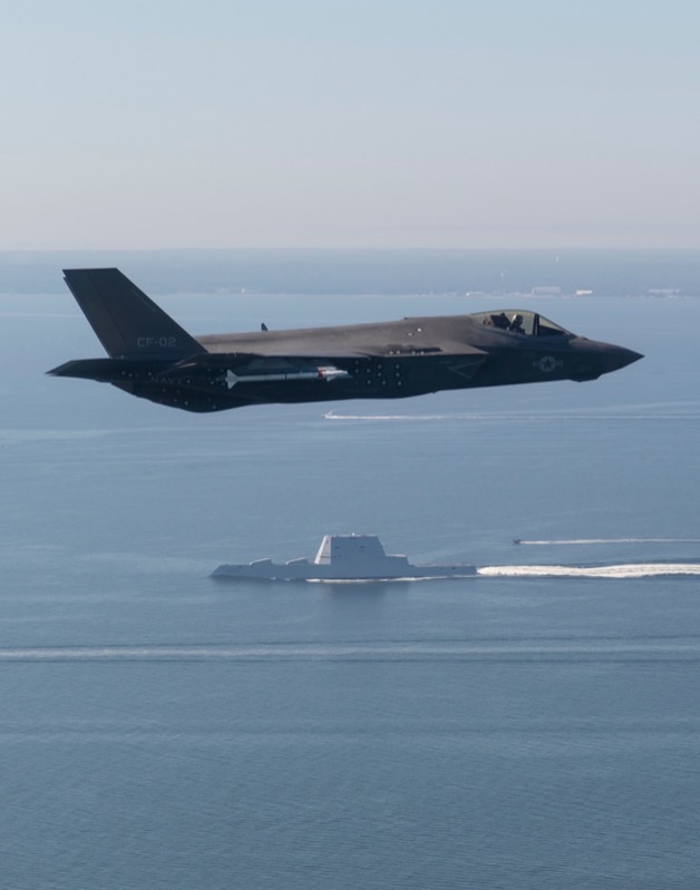 USS Zumwalt's distinctive wave-piercing tumblehome bow cutting through Pacific waters