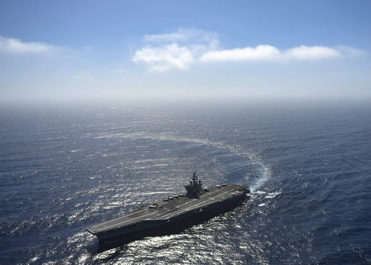 The aircraft carrier USS Nimitz (CVN 68) steams in the Pacific Ocean while conducting carrier qualifications