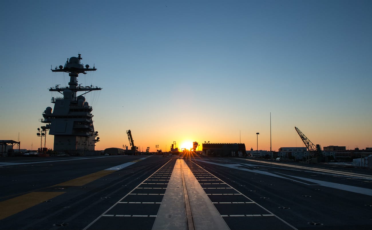 USS Gerald R Ford - The sun rises over PCU Gerald R Ford