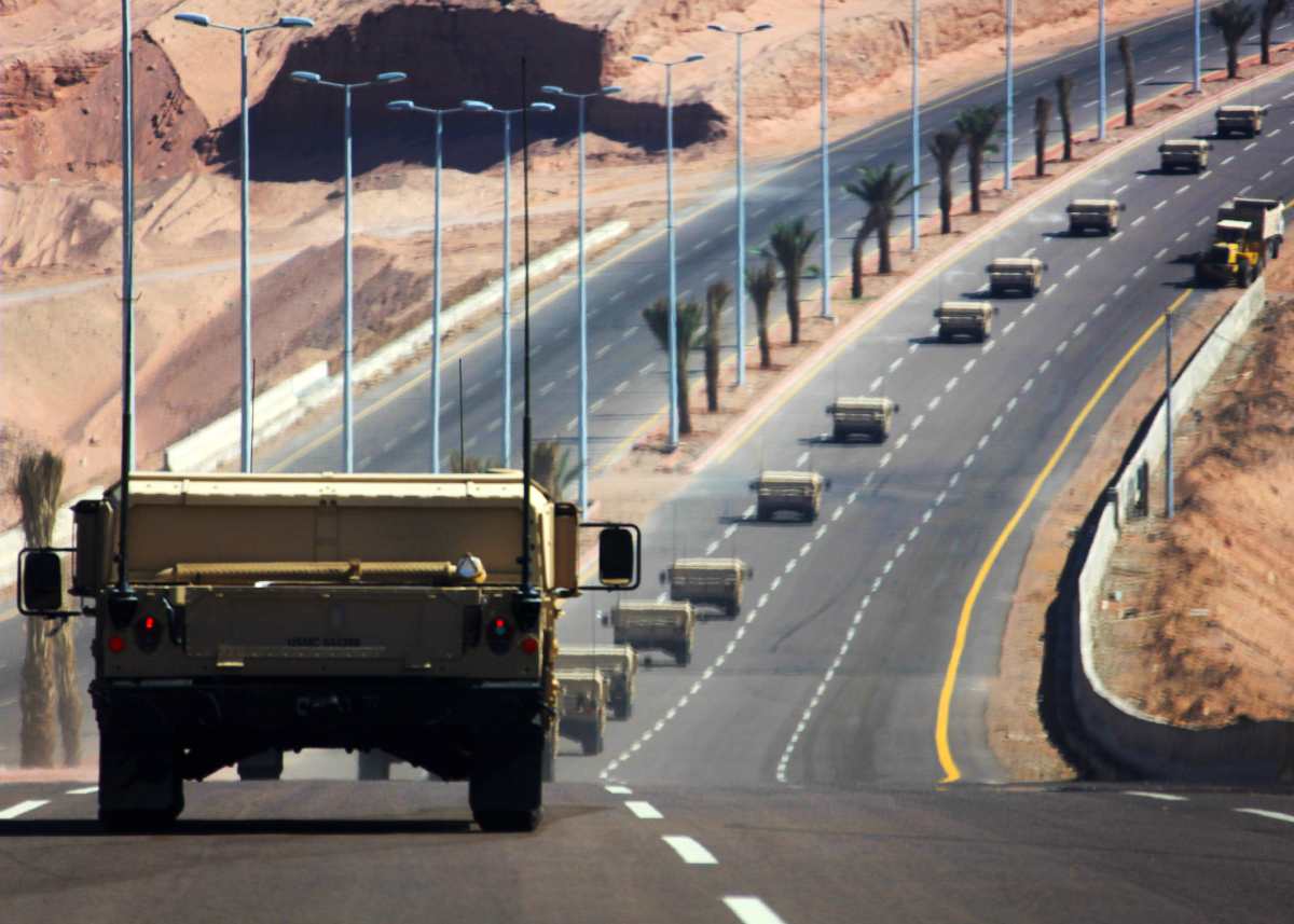 Marines and sailors with the 24th Marine Expeditionary Unit drive Humvees toward the border of the Kingdom of Jordan after offloading from the Maritime Prepositioning Fleet ship USNS Sgt. William R. Button here, during an MPF offload exercise in support of Exercise Eager Lion 12, May 7, 2012. Marines and sailors from the 24th Marine Expeditionary Unit and Iwo Jima Amphibious Ready Group assisted the Combined Forces Maritime Component Command, or CFMCC, during the exercise as part of their current deployment to the U.S. Central Command area of operations as a theater reserve and crisis response force. Eager Lion is a recurring, multinational exercise designed to strengthen military-to-military relationships among partnered nations through scenario-based, realistic modern-day security challenges.